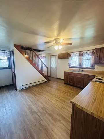 a view of a kitchen with an oven and cabinets