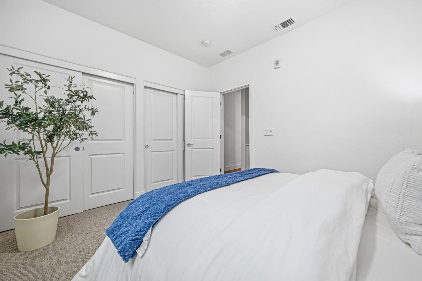 3140 Blanco Terrace Fremont, CA 94536 - Photo 15 of 35 a spacious bedroom with a bed and a potted plant