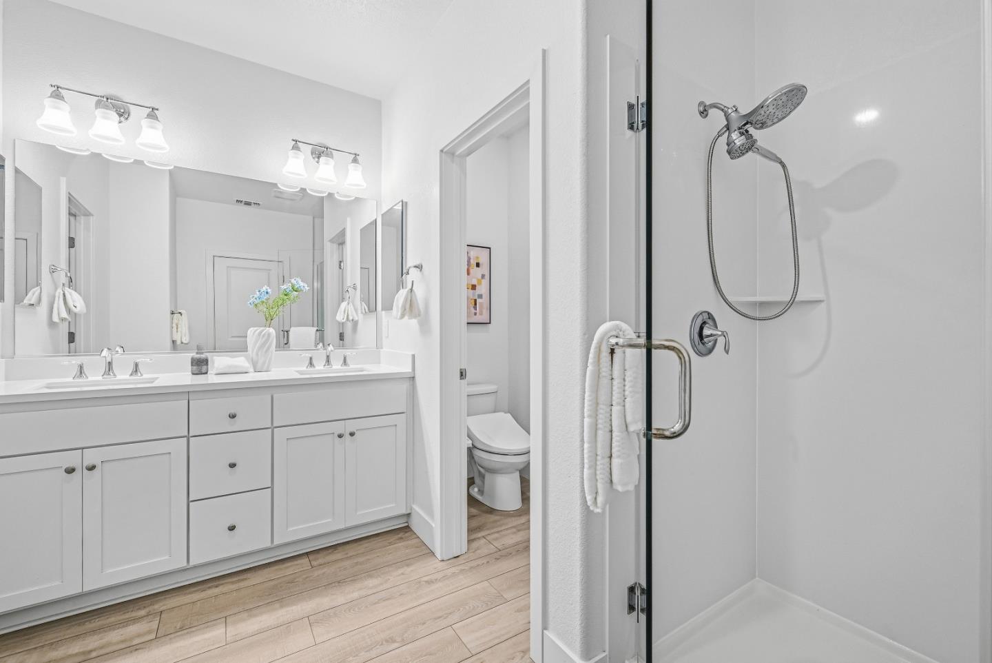 3140 Blanco Terrace Fremont, CA 94536 - Photo 23 of 35 a bathroom with a double vanity sink toilet mirror and shower