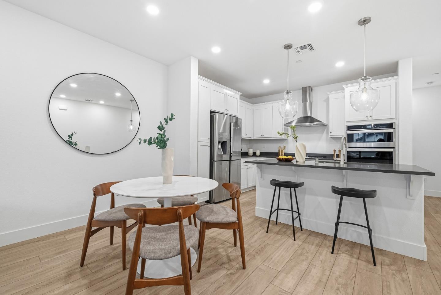 3140 Blanco Terrace Fremont, CA 94536 - Photo 3 of 35 a kitchen with kitchen island a dining table and chairs