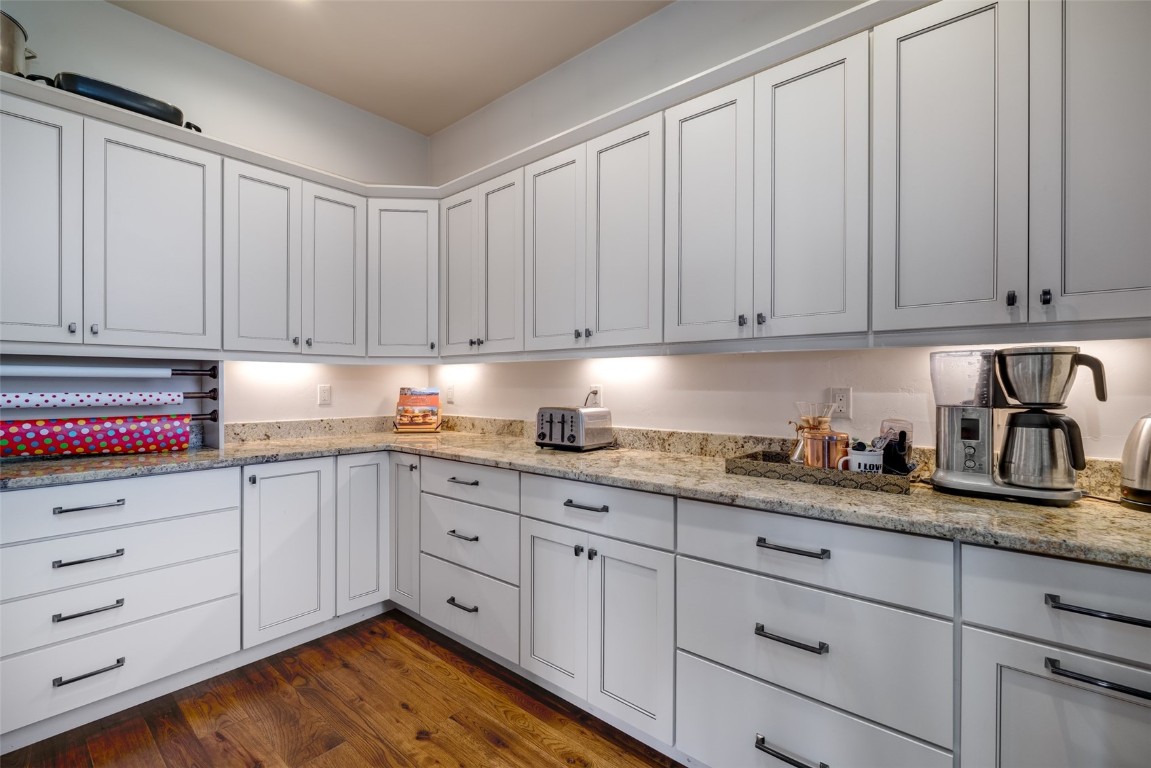 28100 Columbine Ridge Road Steamboat Springs, CO 80487 - Photo 11 of 43 a kitchen with granite countertop white cabinets and stainless steel appliances