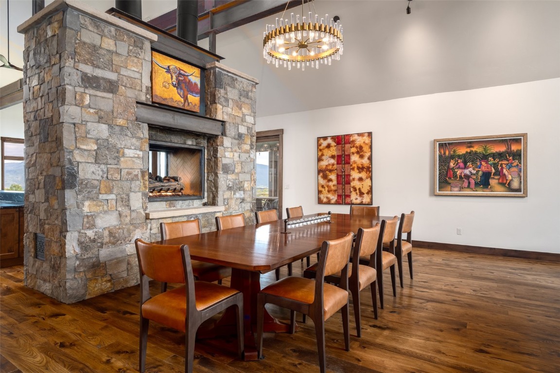 28100 Columbine Ridge Road Steamboat Springs, CO 80487 - Photo 12 of 43 a view of a dining room with furniture and wooden floor