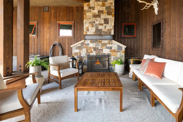 a view of a table and chairs in backyard