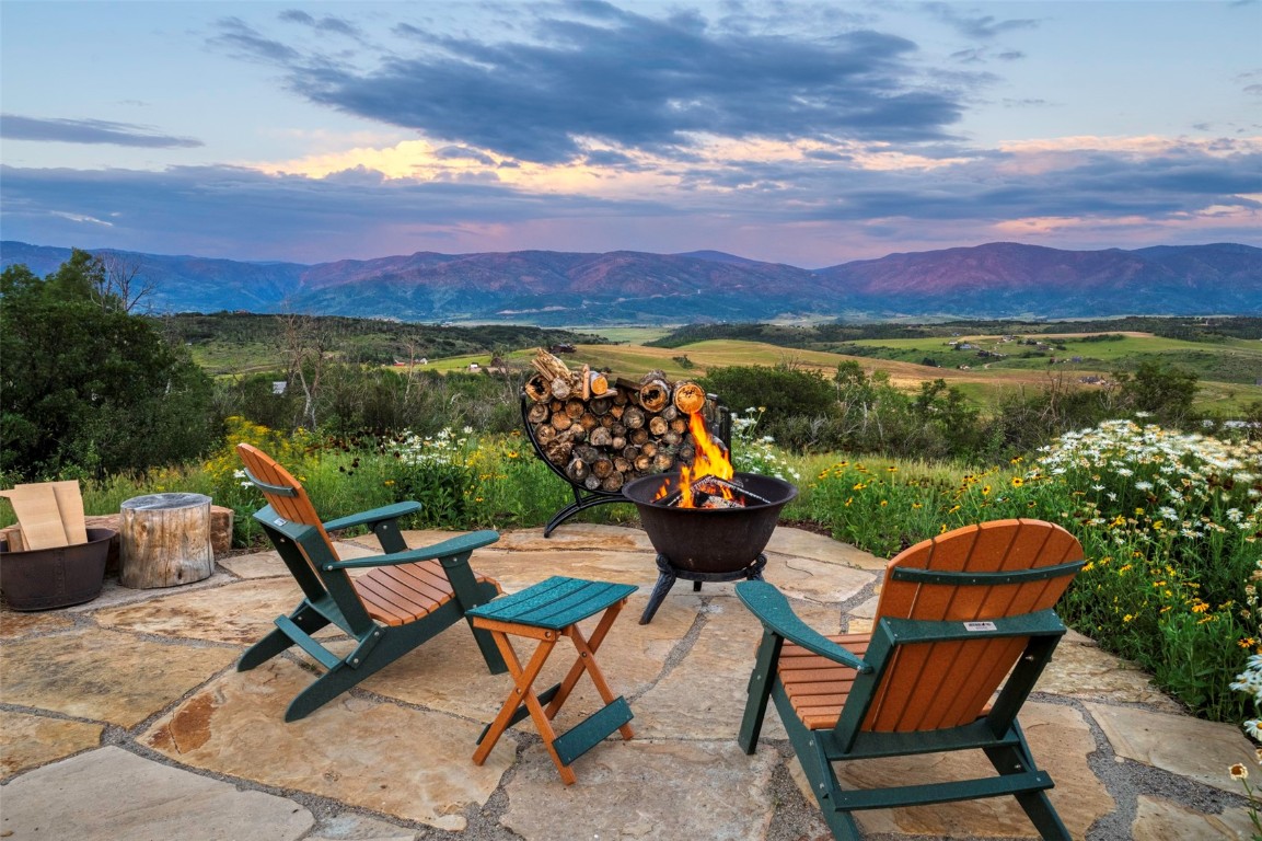 28100 Columbine Ridge Road Steamboat Springs, CO 80487 - Photo 18 of 43 a view of a chairs and table in the terrace