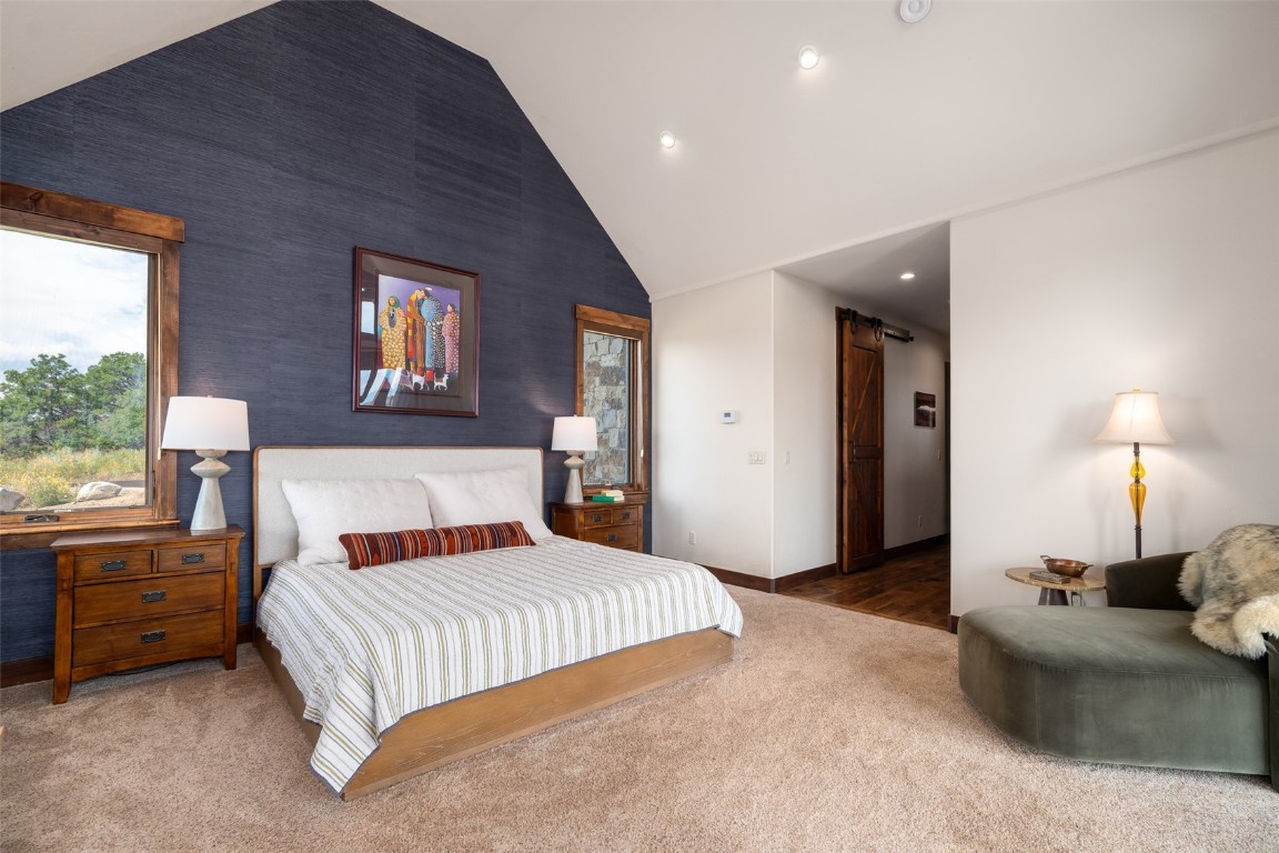 28100 Columbine Ridge Road Steamboat Springs, CO 80487 - Photo 21 of 43 a bedroom with a bed and a night stand