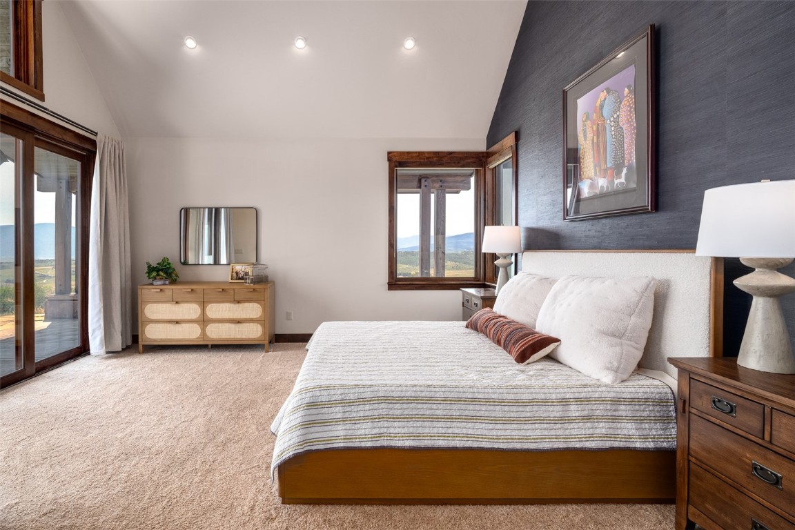 28100 Columbine Ridge Road Steamboat Springs, CO 80487 - Photo 23 of 43 a bedroom with bed and window