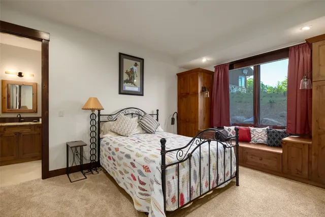 a view of a workspace with furniture and wooden floor