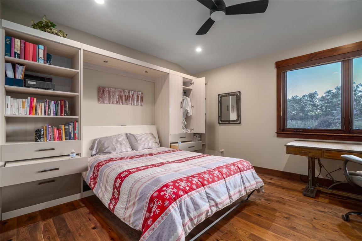 28100 Columbine Ridge Road Steamboat Springs, CO 80487 - Photo 36 of 43 a bedroom with a bed and a bookshelf