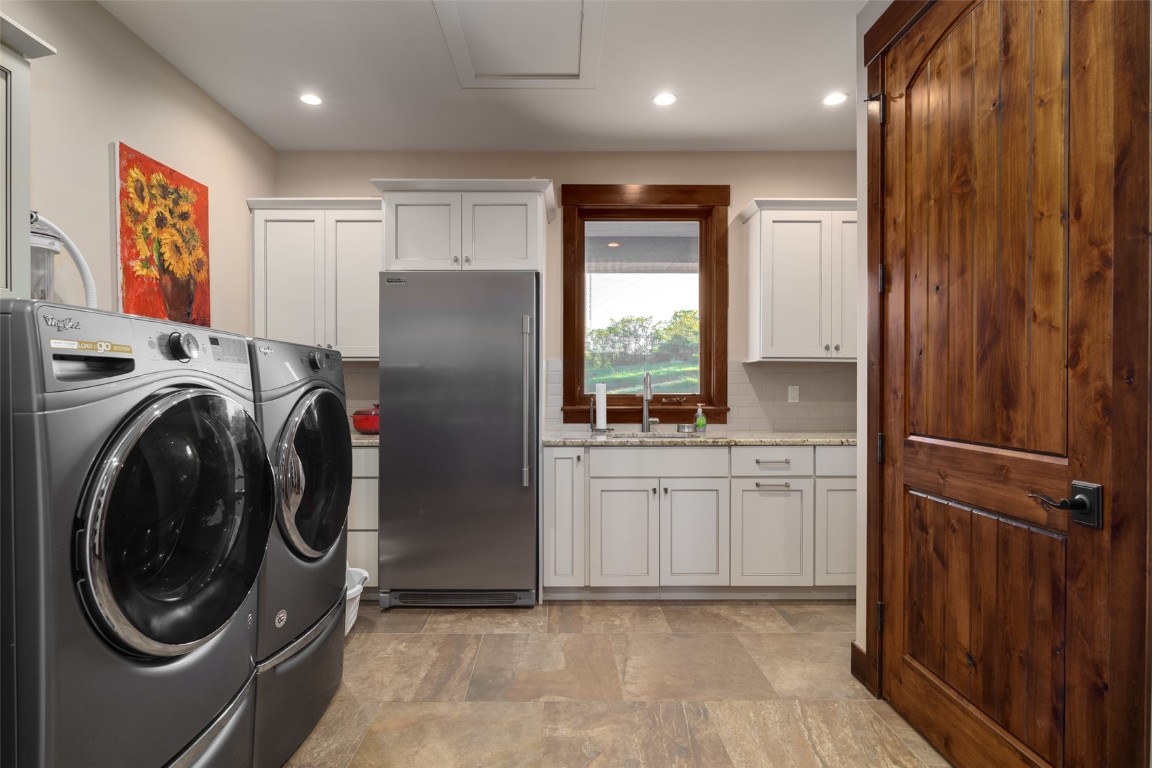 28100 Columbine Ridge Road Steamboat Springs, CO 80487 - Photo 38 of 43 a kitchen with stainless steel appliances granite countertop a refrigerator and a sink