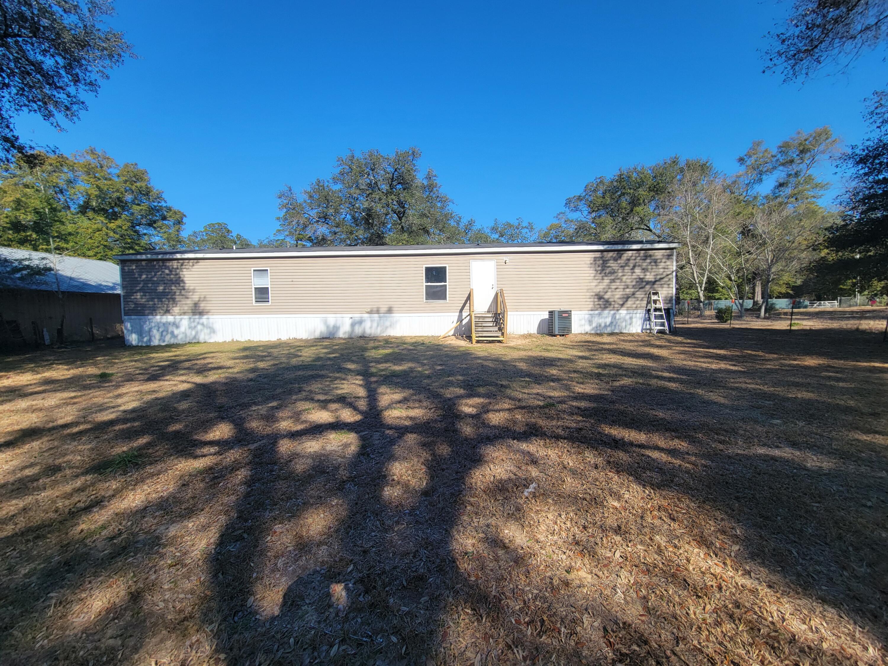 188 O'Daniels Way DeFuniak Springs, FL 32433 - Photo 4 of 17 a view of outdoor space and yard