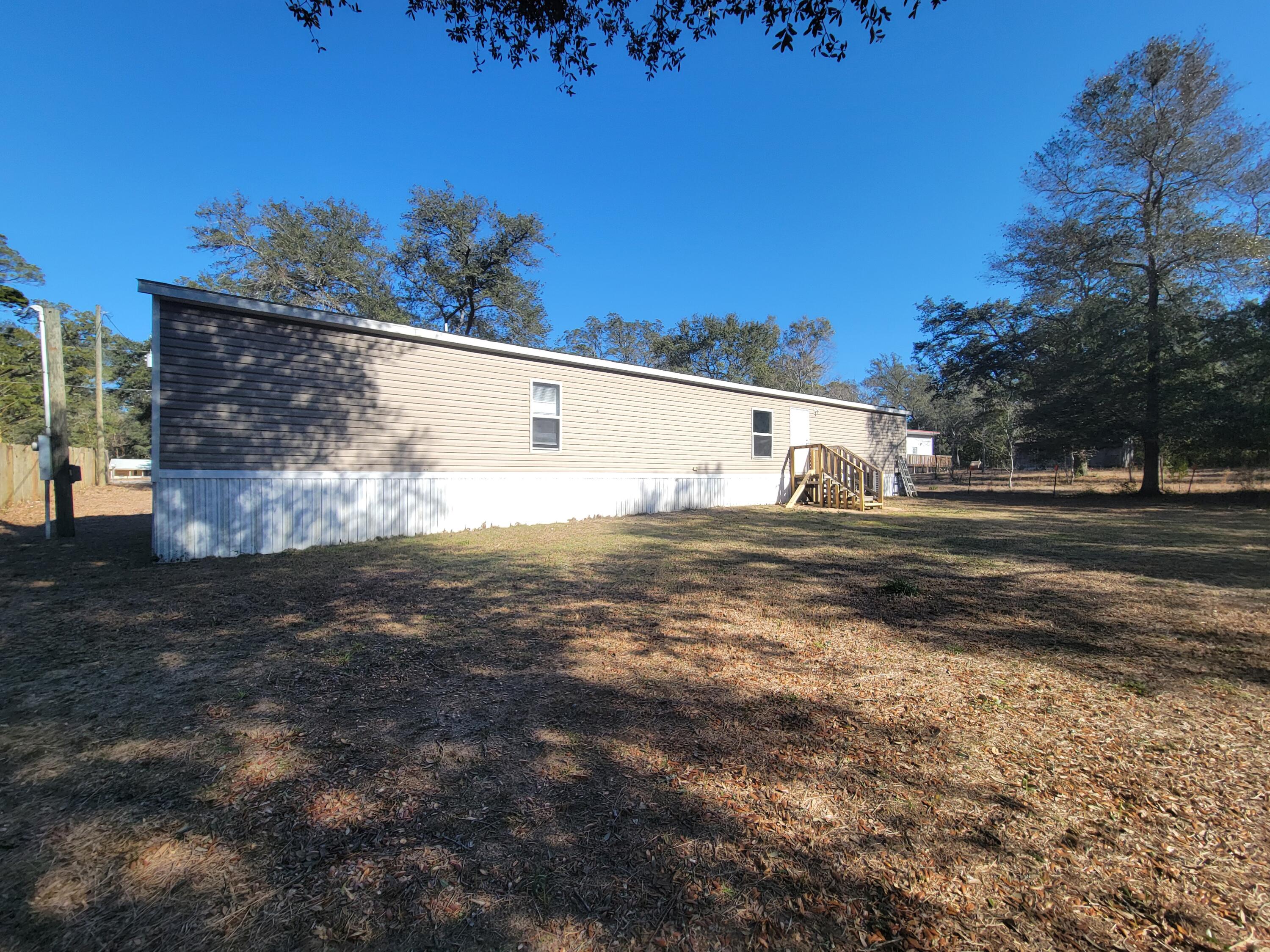 188 O'Daniels Way DeFuniak Springs, FL 32433 - Photo 5 of 17 a view of back yard of the house