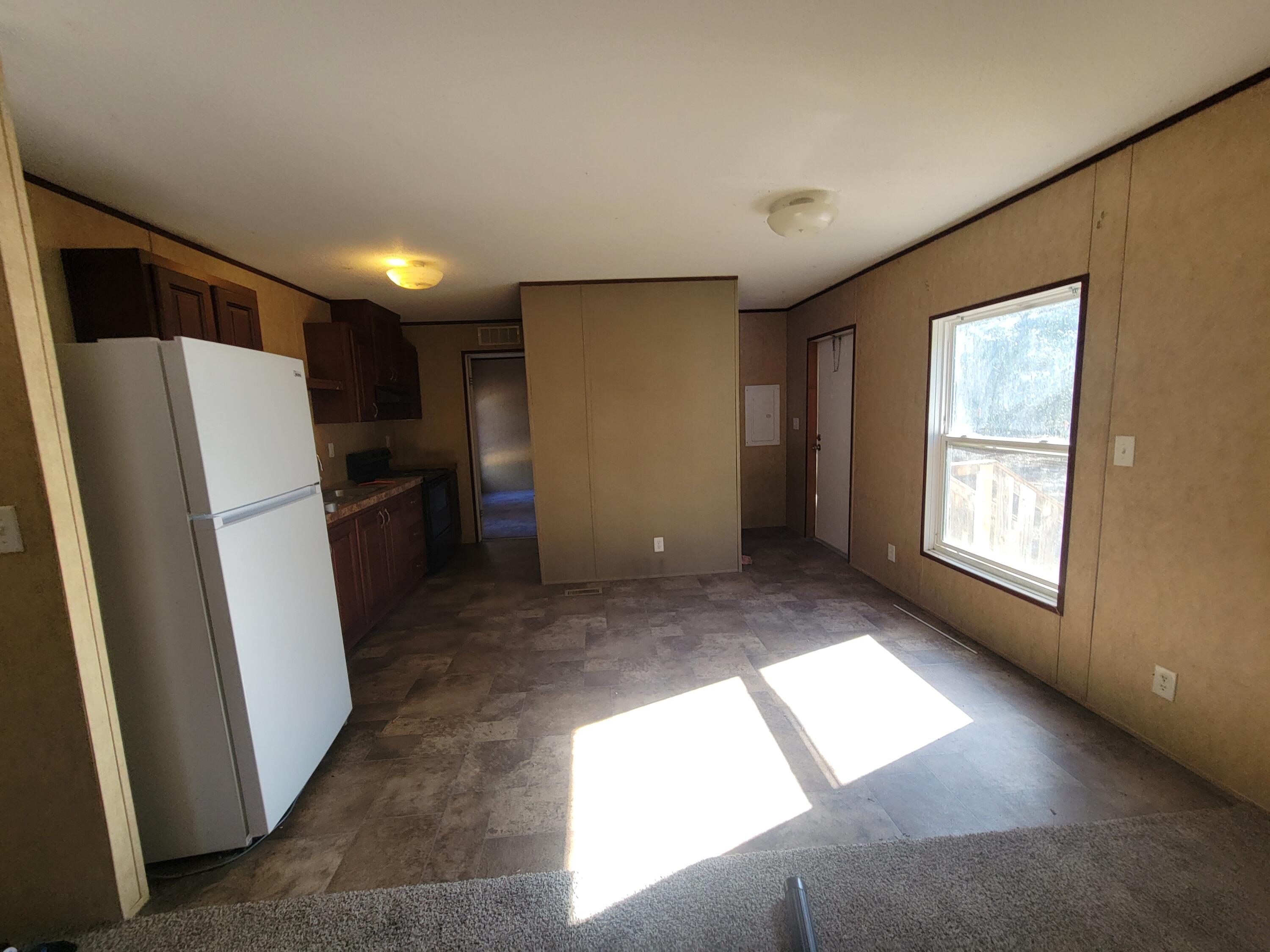 188 O'Daniels Way DeFuniak Springs, FL 32433 - Photo 8 of 17 a view of entryway with window and refrigerator