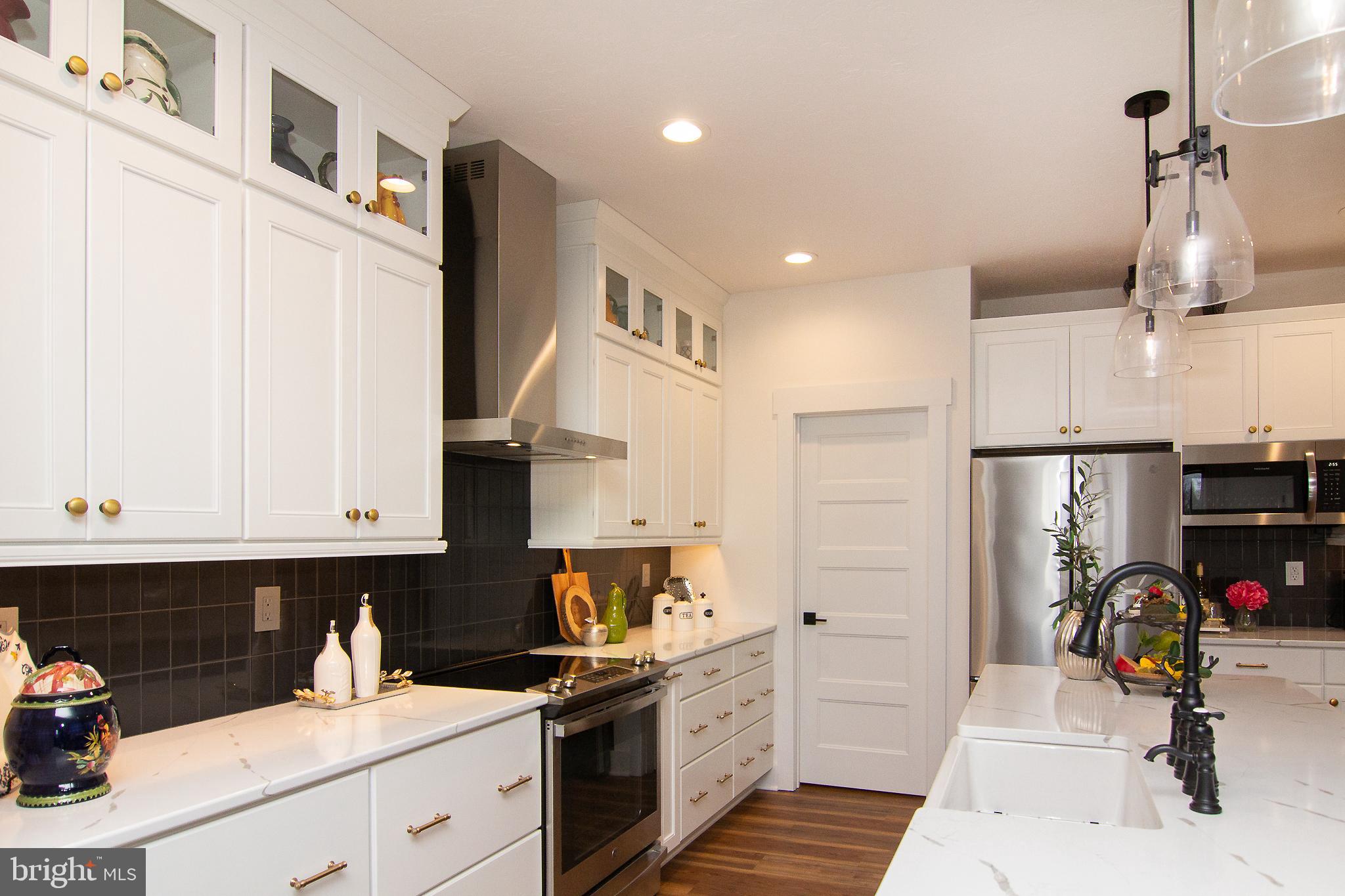 P39 Schalk Road Manchester, MD 21102 - Photo 11 of 20 a kitchen with stainless steel appliances granite countertop a refrigerator and a stove top oven