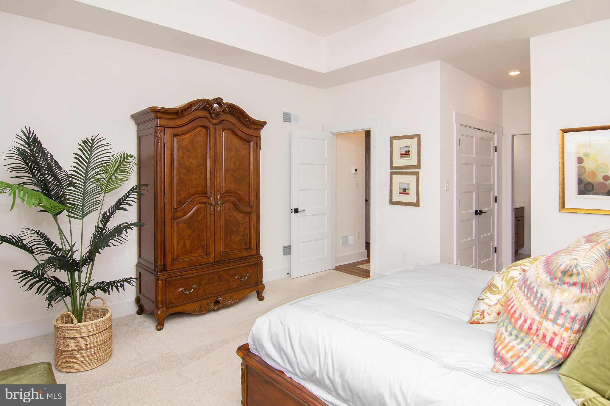 P39 Schalk Road Manchester, MD 21102 - Photo 14 of 20 a bedroom with a potted plant and a chair