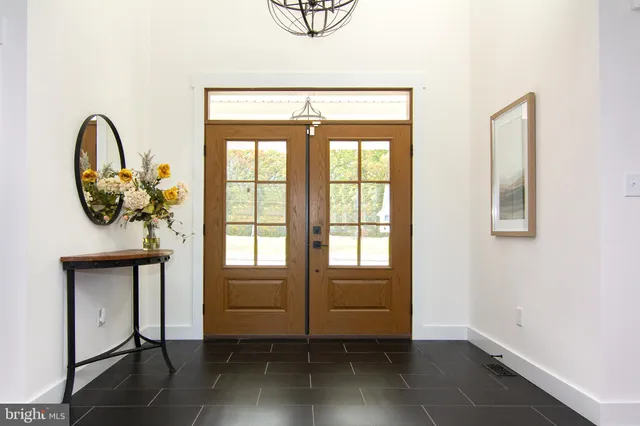 a view of a livingroom with wooden floor and a window