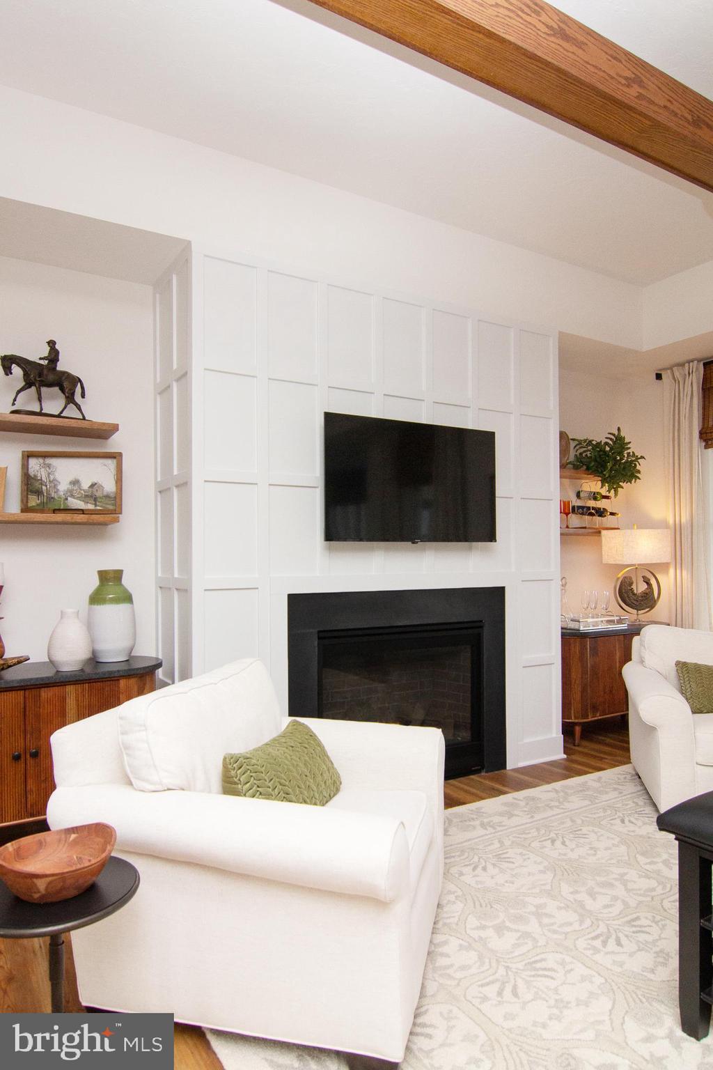 P39 Schalk Road Manchester, MD 21102 - Photo 5 of 20 a living room with furniture a flat screen tv and a fireplace