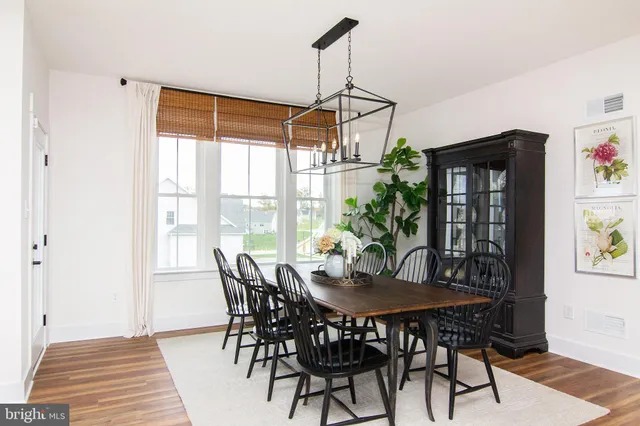 a living room with fireplace furniture and a wooden floor