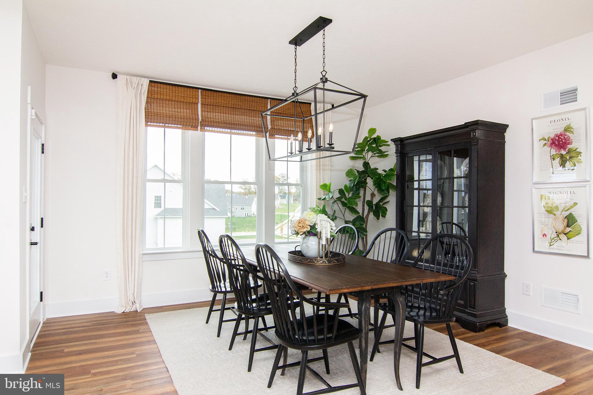 P39 Schalk Road Manchester, MD 21102 - Photo 7 of 20 a view of a dining room with furniture window and wooden floor