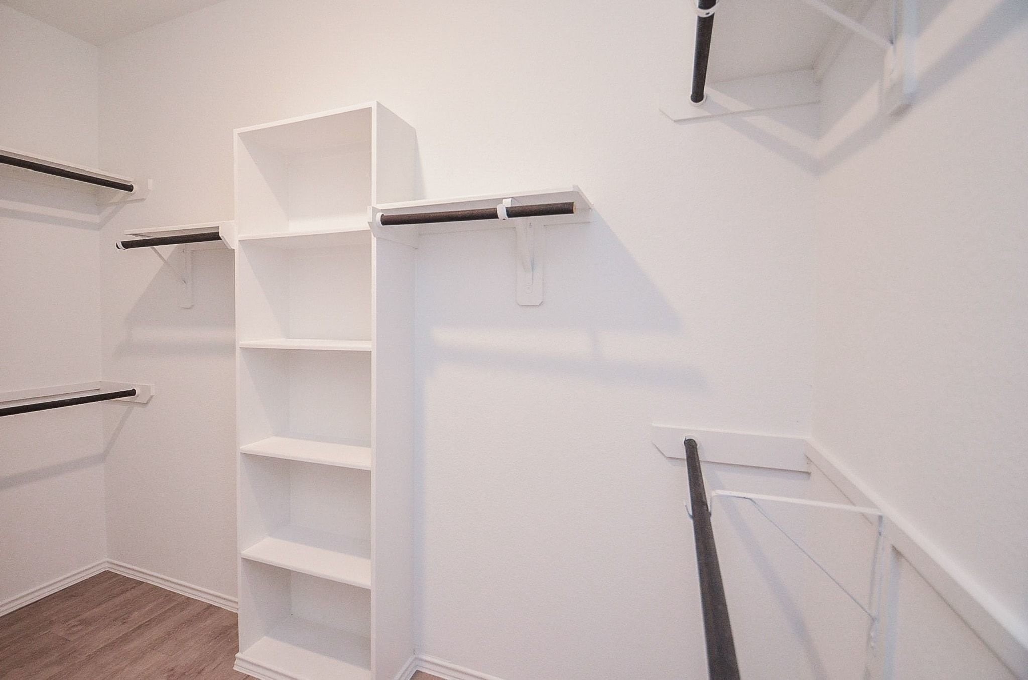 3820 Vista Grove Court Rosenberg, TX 77469 - Photo 27 of 36 Primary walk-in closets with new hardwood floors