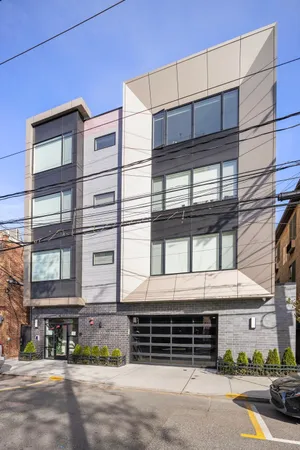 a front view of a building with a street