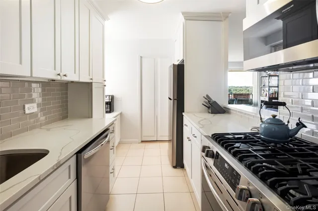 a kitchen with a stove and a refrigerator