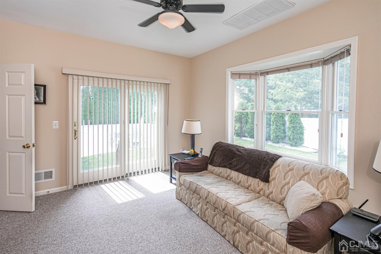 30 Aster Way Dayton, NJ 08810 - Photo 16 of 38 a living room with furniture and a large window