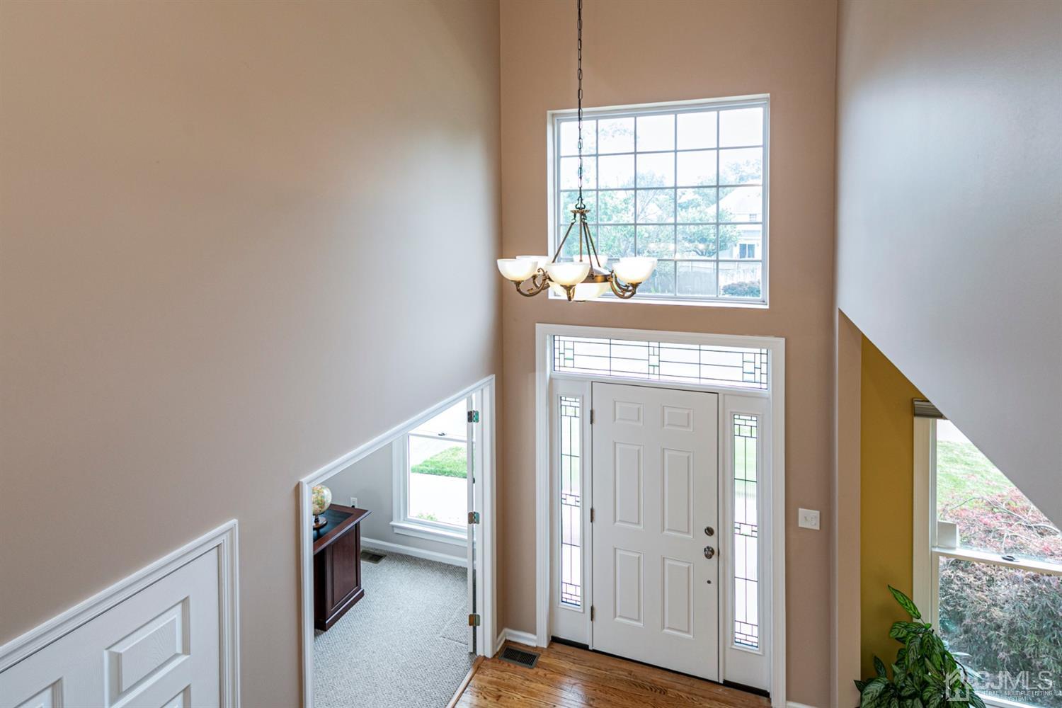 30 Aster Way Dayton, NJ 08810 - Photo 17 of 38 a view of an entryway with wooden floor and windows