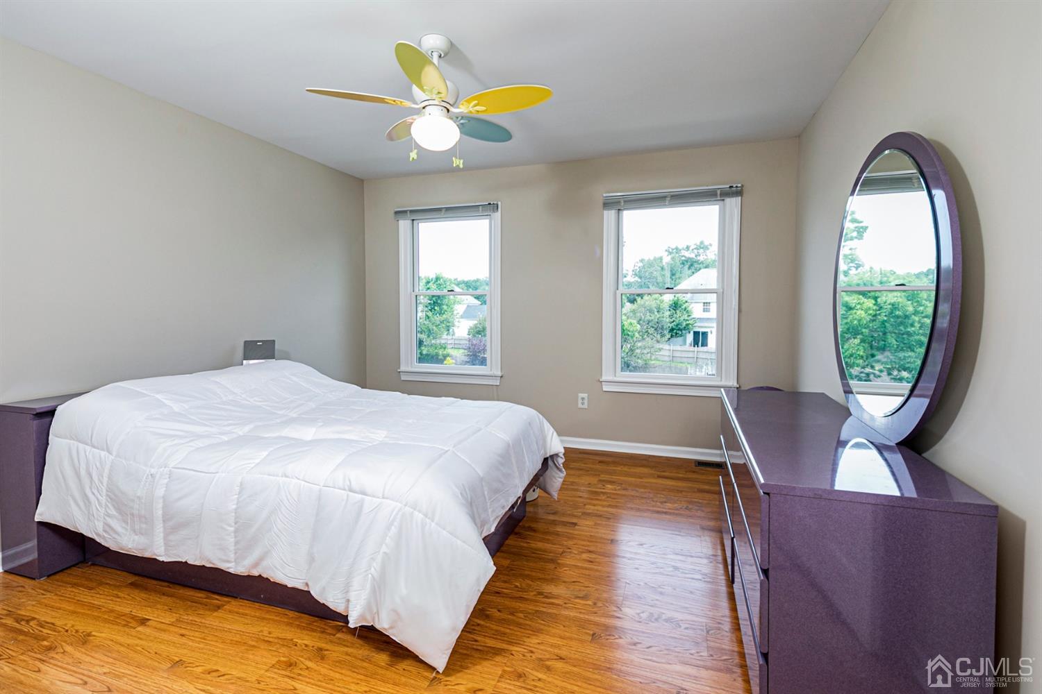 30 Aster Way Dayton, NJ 08810 - Photo 23 of 38 a bed sitting in a bedroom next to a window