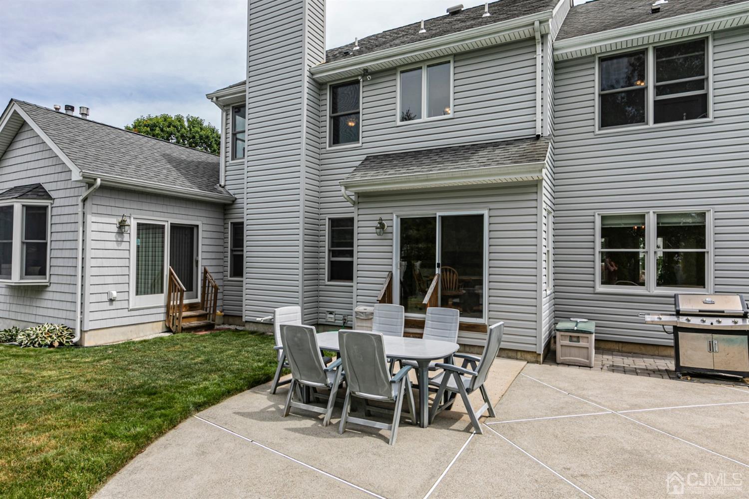 30 Aster Way Dayton, NJ 08810 - Photo 29 of 38 a view of a house with a backyard and a patio