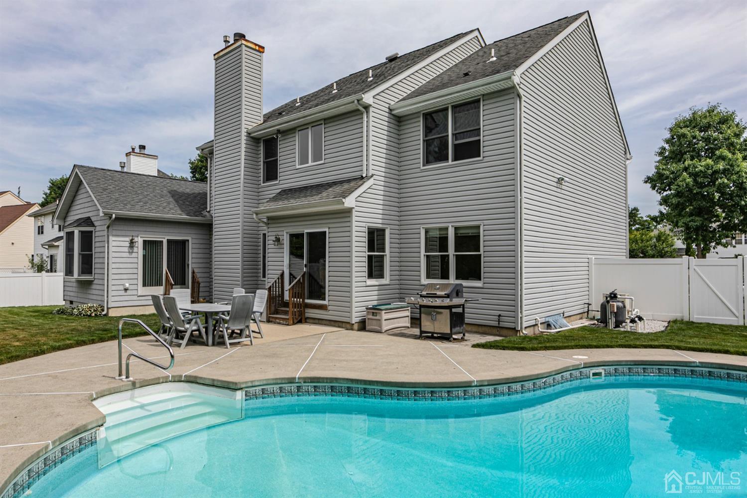 30 Aster Way Dayton, NJ 08810 - Photo 30 of 38 a view of a house with swimming pool and sitting area