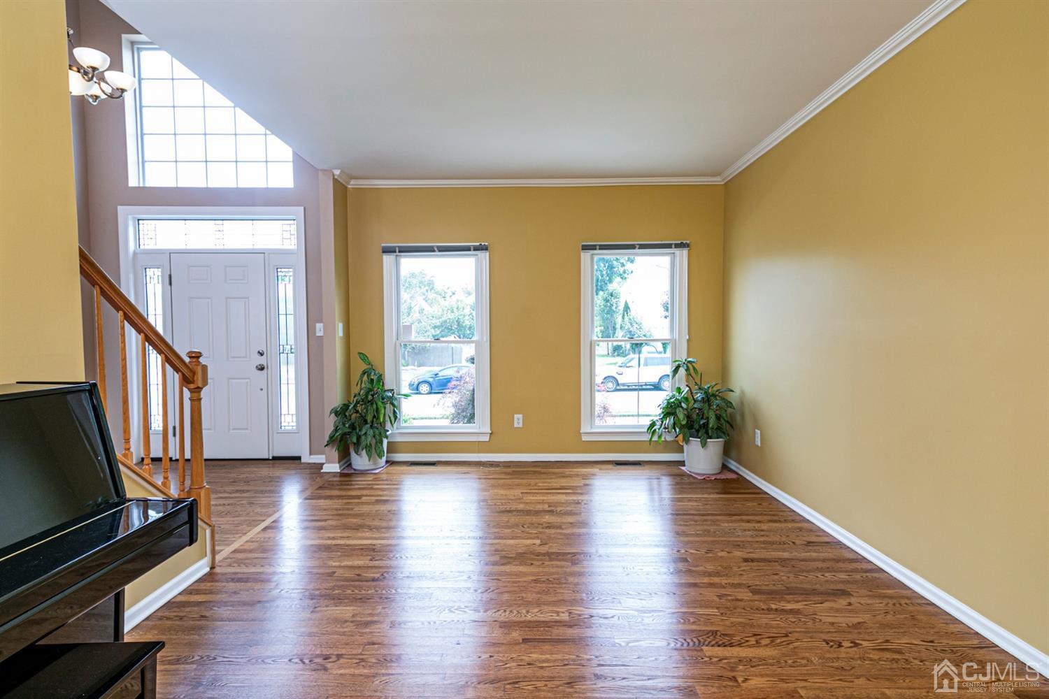 30 Aster Way Dayton, NJ 08810 - Photo 7 of 38 a view of an empty room with wooden floor and a window