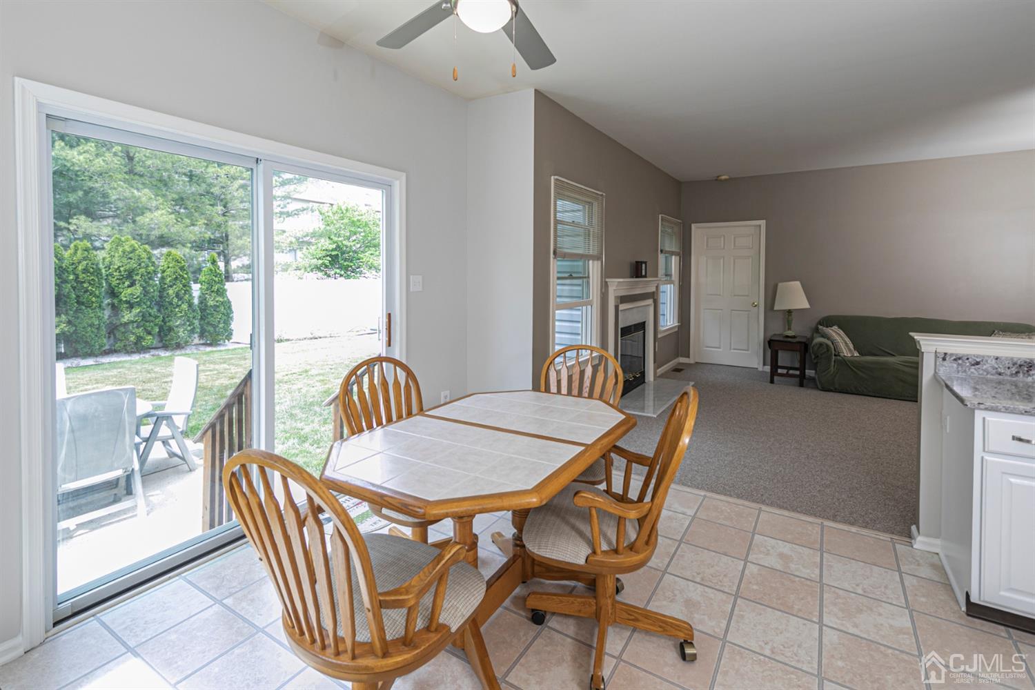 30 Aster Way Dayton, NJ 08810 - Photo 9 of 38 a dining room with furniture a chandelier and wooden floor