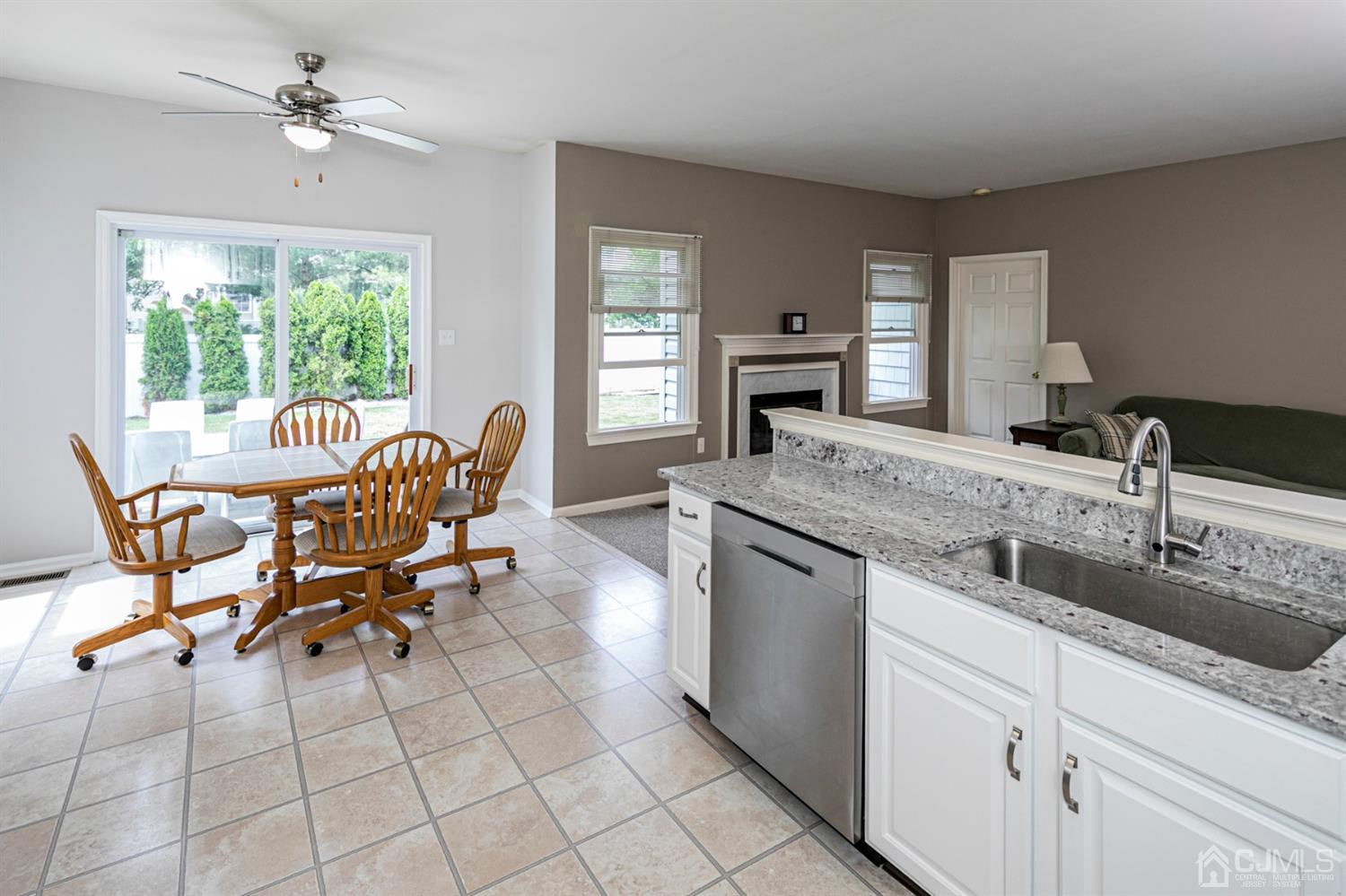 30 Aster Way Dayton, NJ 08810 - Photo 10 of 38 a dining hall with stainless steel appliances granite countertop a sink and a large window