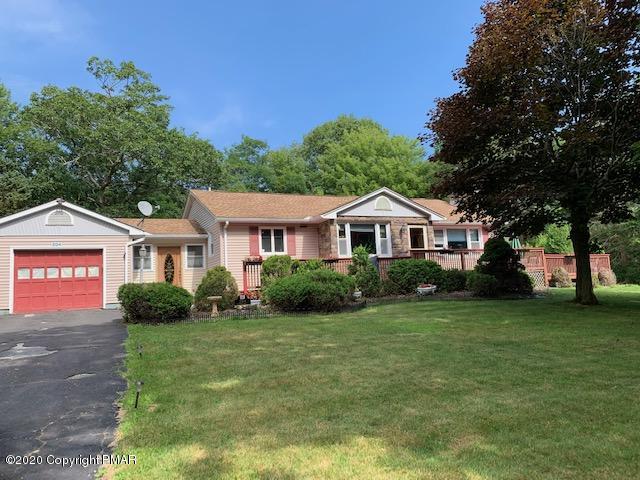 204 Winona Road Mount Pocono, PA 18344 - Photo 1 of 41 a front view of a house with a yard
