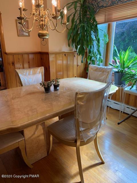 204 Winona Road Mount Pocono, PA 18344 - Photo 12 of 41 a view of a dining room with furniture and wooden floor