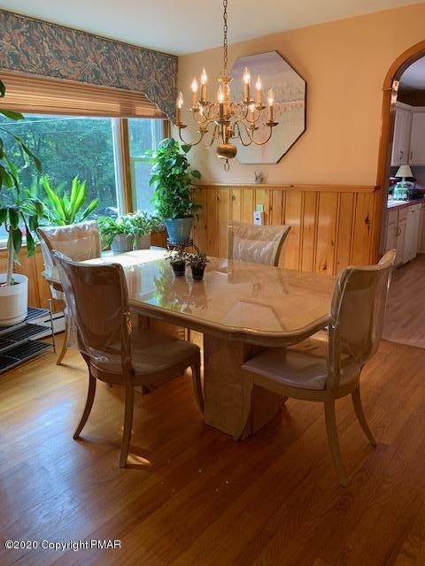 204 Winona Road Mount Pocono, PA 18344 - Photo 13 of 41 a dining room with furniture a large window and wooden floor
