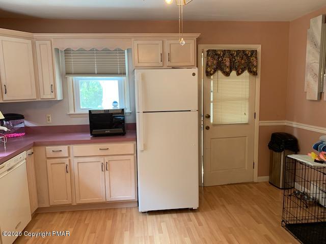 204 Winona Road Mount Pocono, PA 18344 - Photo 17 of 41 a white refrigerator freezer sitting in a kitchen