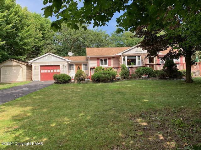 204 Winona Road Mount Pocono, PA 18344 - Photo 2 of 41 a front view of a house with a garden
