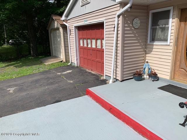 204 Winona Road Mount Pocono, PA 18344 - Photo 30 of 41 a house with a yard