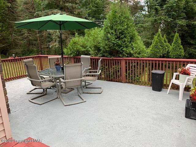 204 Winona Road Mount Pocono, PA 18344 - Photo 34 of 41 a view of backyard with two chairs and wooden fence