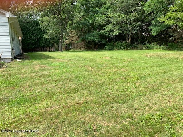 204 Winona Road Mount Pocono, PA 18344 - Photo 36 of 41 a view of green field with trees in the background