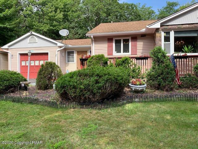 204 Winona Road Mount Pocono, PA 18344 - Photo 4 of 41 a front view of a house with a yard and potted plants