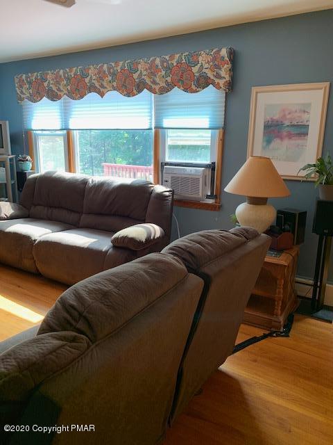 204 Winona Road Mount Pocono, PA 18344 - Photo 7 of 41 a living room with furniture and a large window