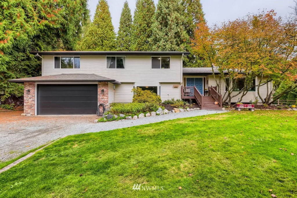 22420 61st Avenue Southeast Bothell, WA 98021 - Photo 2 of 39 a front view of house with yard and green space