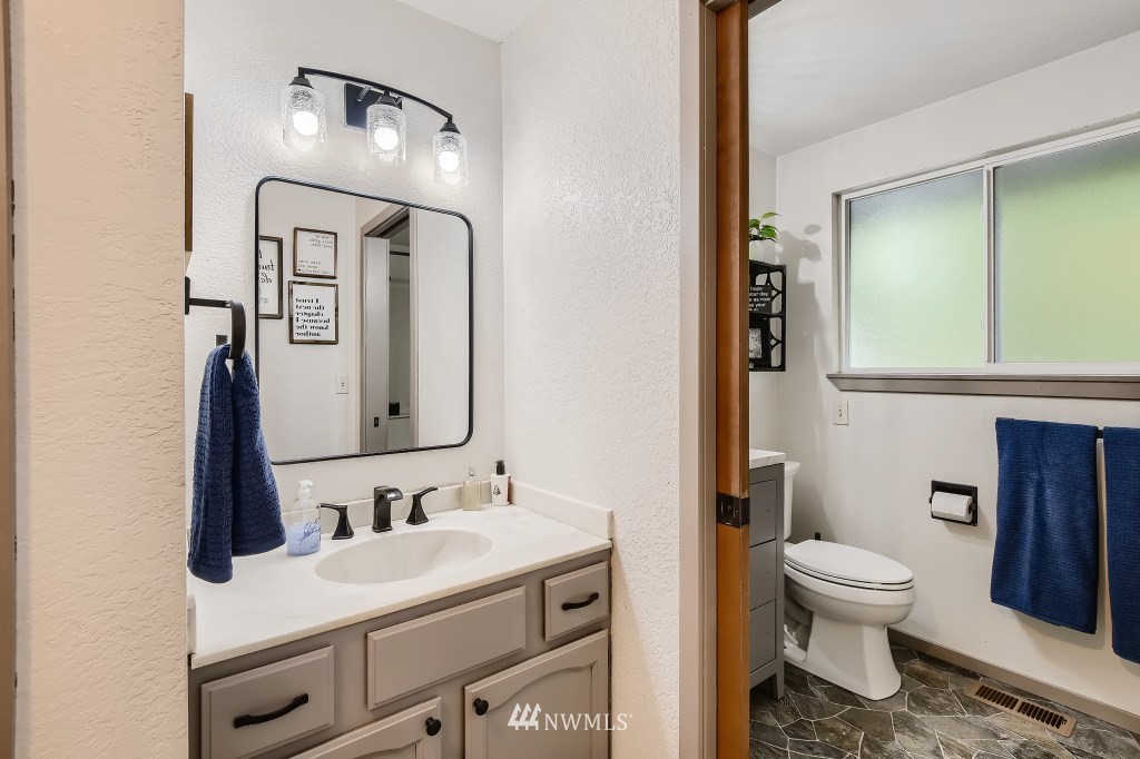 22420 61st Avenue Southeast Bothell, WA 98021 - Photo 15 of 39 a bathroom with a toilet sink and mirror