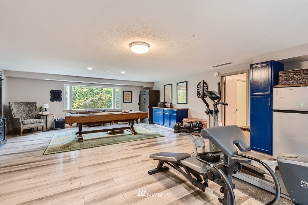 22420 61st Avenue Southeast Bothell, WA 98021 - Photo 25 of 39 a room with gym equipment and windows