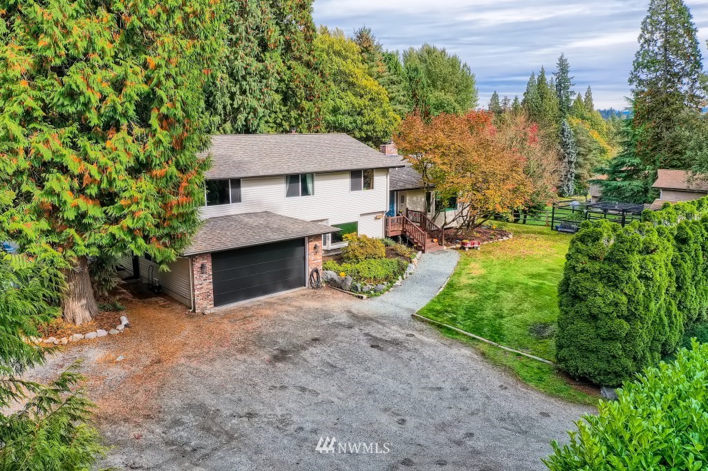 22420 61st Avenue Southeast Bothell, WA 98021 - Photo 39 of 39 a view of a house with yard and a garden