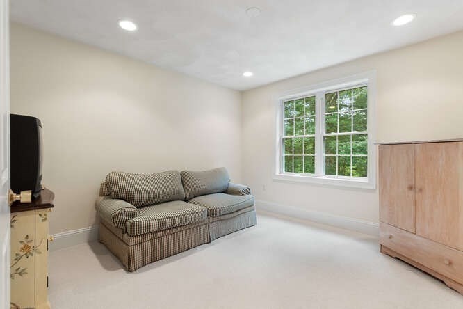 1 Ash Lane Georgetown, MA 01833 - Photo 35 of 42 a living room with furniture and a flat screen tv
