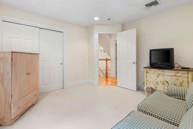 1 Ash Lane Georgetown, MA 01833 - Photo 36 of 42 a bedroom with a bed and a flat screen tv