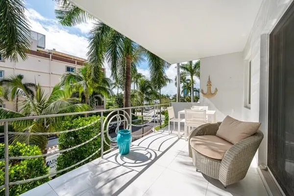 a view of a chairs and table in patio
